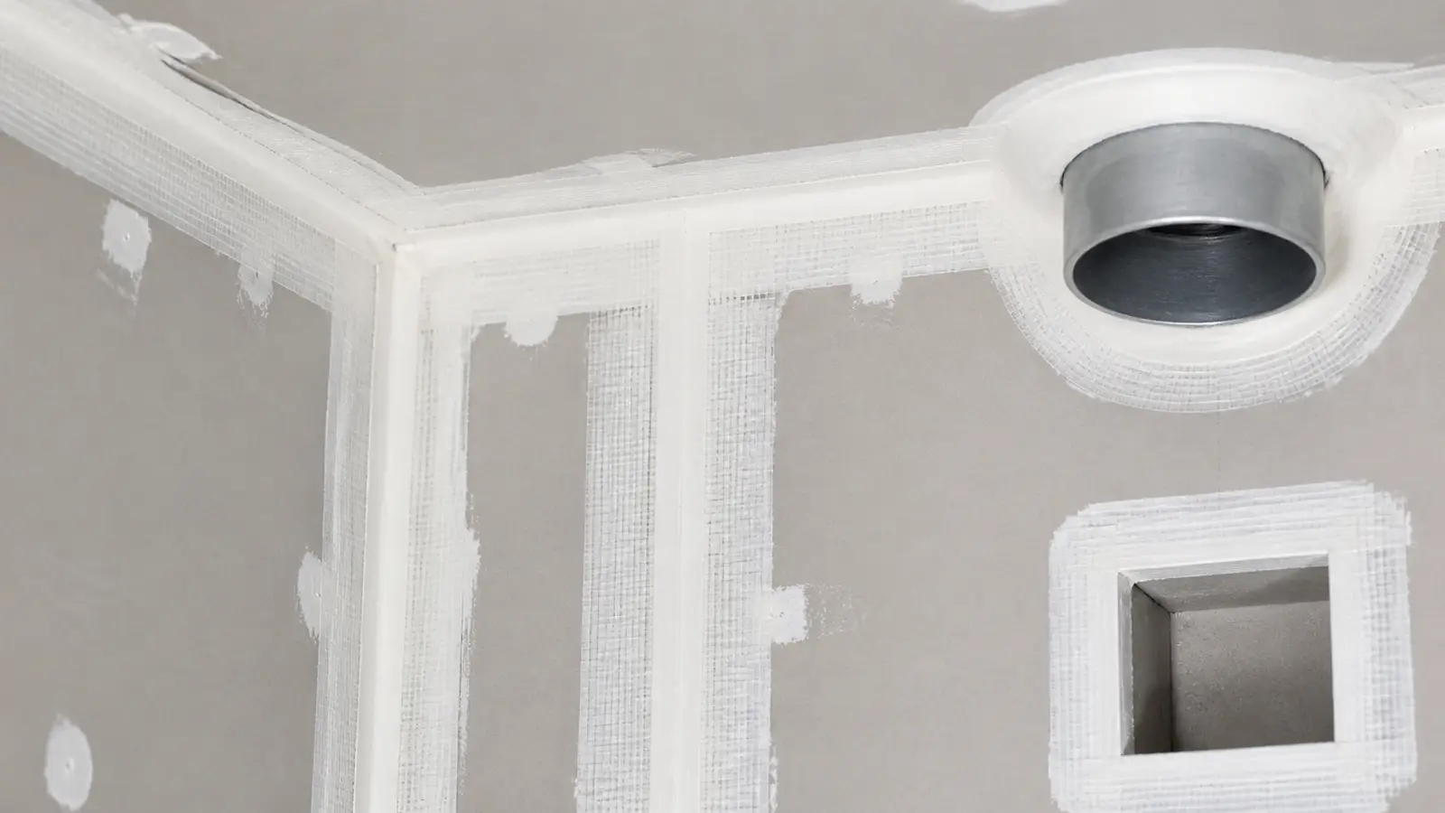 Taped drywall seams forming a continuous air barrier